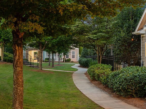 Lush landscaping and modern design create the perfect first impression.