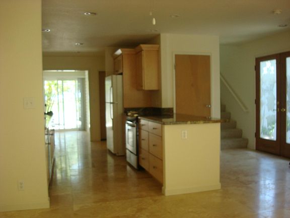 Open kitchen; front door from inside.....all travertine floo