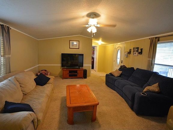 YET ANOTHER VIEW OF THE MAIN AREA OF THE HOUSE. WINDOW TO RIGHT OVERLOOKS THE BIG MULTILEVEL DECK