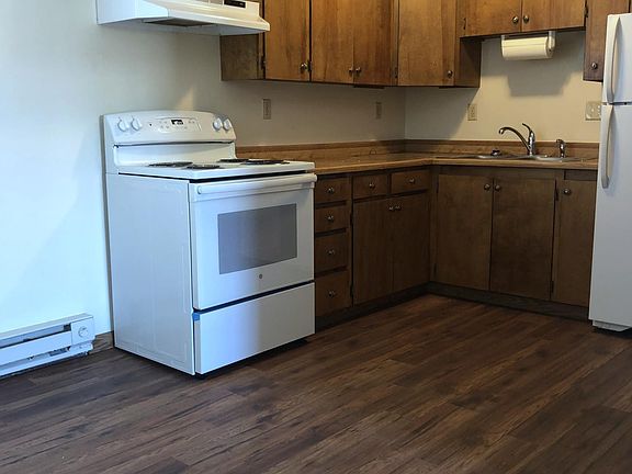 New laminate flooring in kitchen, with new stove.