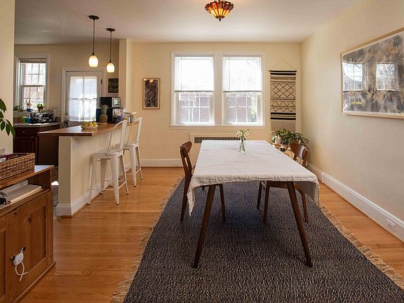 Large, sunny dining room open to kitchen.