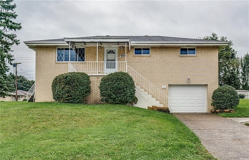 View of the front of this beautiful brick home in the Windgap area. It sits on a large corner lot with plenty of yard space and 