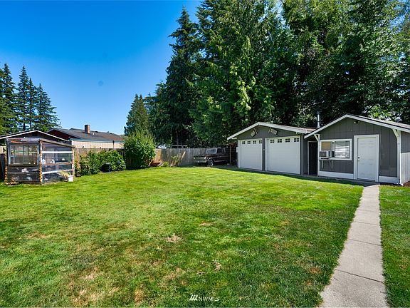 Large back yard with 440 sqft shop for parking or working on projects. Extra finished 12'x16' building could make a great guest suite or   home office! Or???