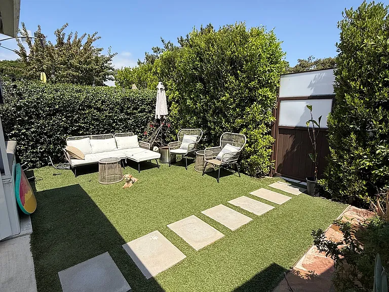 yard with path from front gate into your French doors and flagstone off to the side great for a bbq and chairs