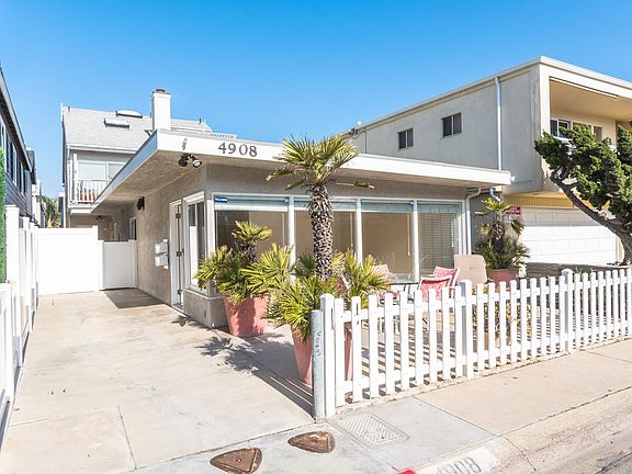 TWO 2 CAR GARAGE (TANDEM STYLE) IN THE REAR AND 2 ADDITIONAL PARKING SPOTS ON THE DRIVEWAY