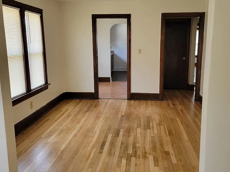 Dining room leading to breakfast nook and hallway leading to 2 bedrooms and bathroom with new windows.
