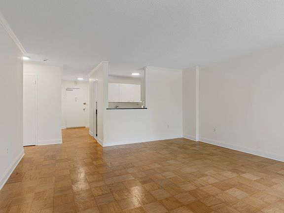 Dining area toward kitchen & front door