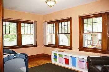 Large sunroom is currently being used as a playroom, but would make a beautiful office or reading room. 