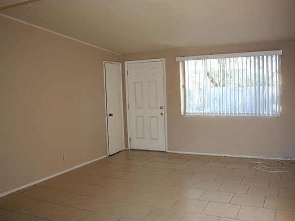 Large living room with entrance door