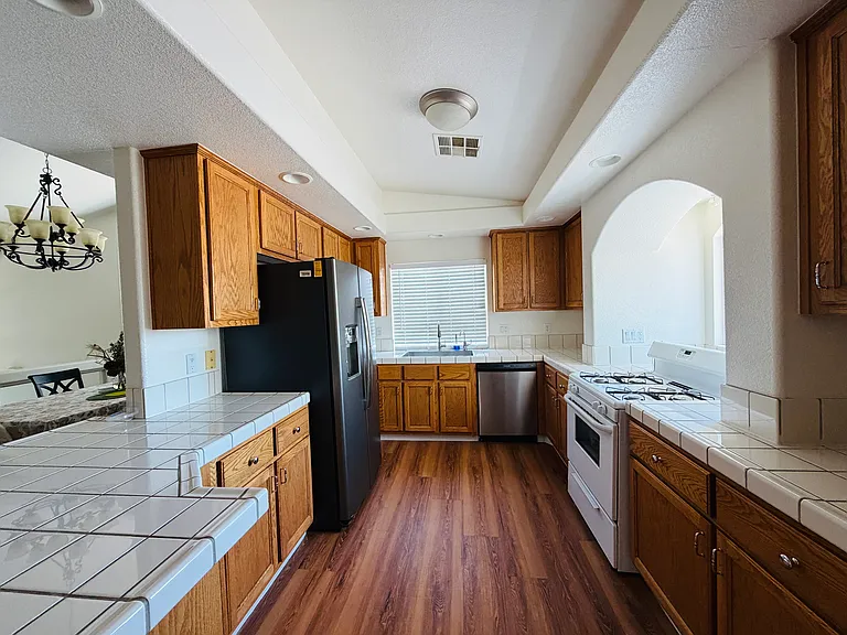 Spacious shared kitchen with plenty of cabinet and counter space