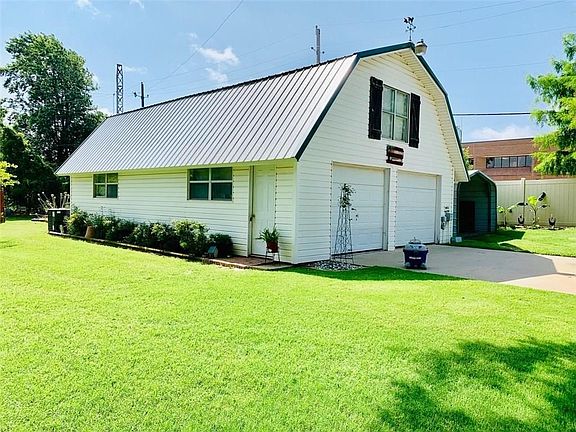24x36 two story shop with central heat and air. For the hobby enthusiast, this property can garage six cars, maybe more.  The upstairs of this shop has so many options!  Directly behind the shop is a large raised garden.