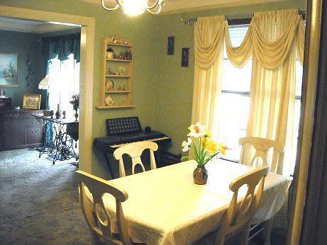 Formal Dining Room with custom window treatments