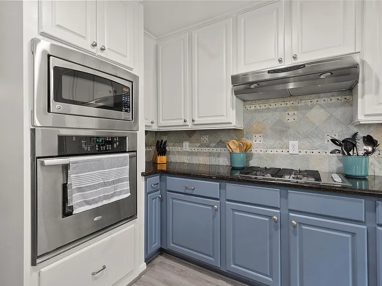 fully stocked kitchen with stemware, cups, glasses, dishes, bowls, plates, silverware, pots, pans, cast iron fry pan, Ninja air fryer, blender, multifunction pressure cooking pot, baking sheets...