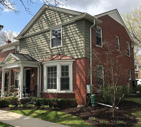 Front of home, corner unit with a bay window