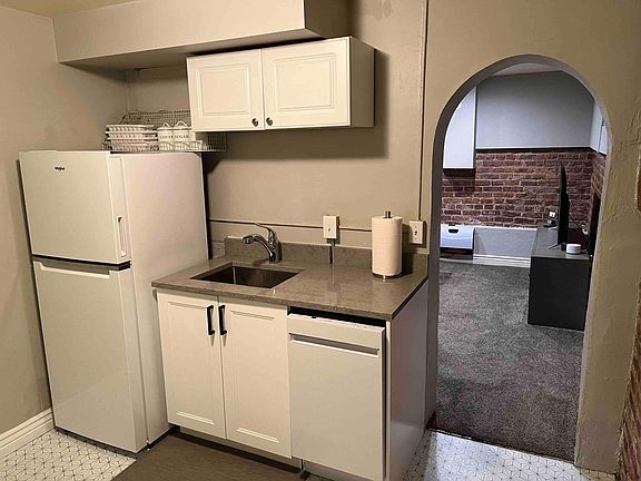 Dishwasher, garbage disposal, quartz countertops and stainless steel sink and faucet