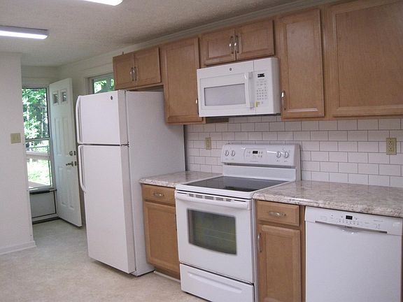 Kitchen cabinetry on back, east facing wall of home