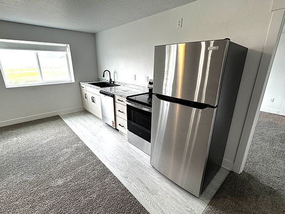 Brand new kitchen appliances with above range microwave being installed before move in.