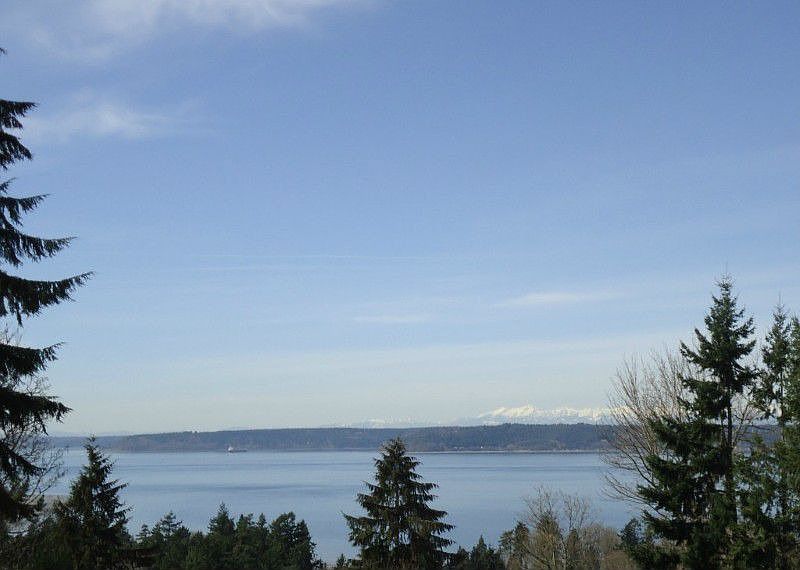 Enjoy a view of Puget Sound and the Olympics from this large lot in Ventana.