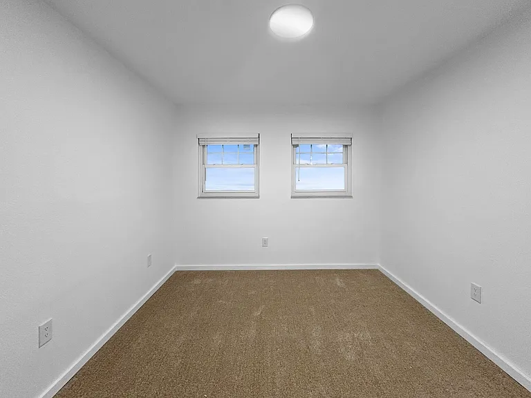 Bedroom with fresh carpet and energy efficient windows