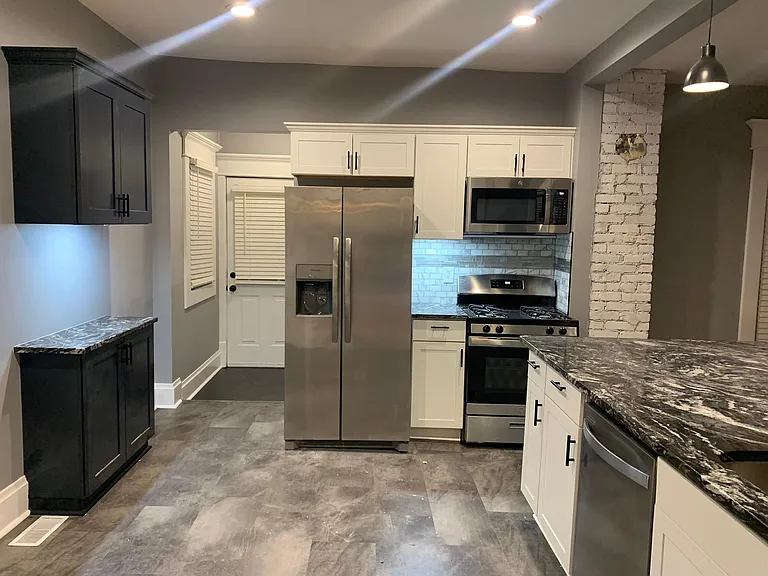 Floors have been replaced with black/white checkerboard LVP