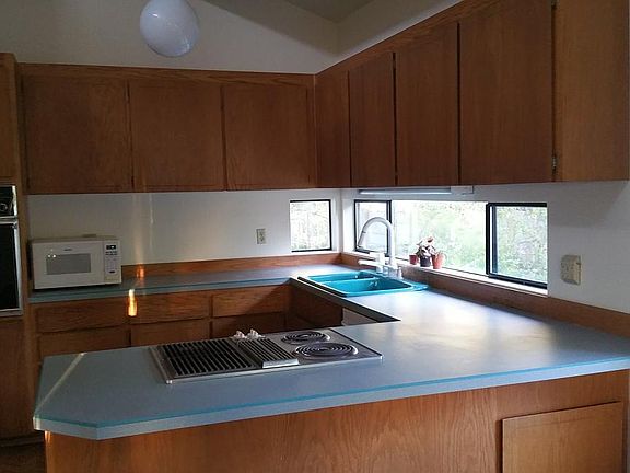 Kitchen (New glass top oven to be installed. Oven in picture will be converted to cabinet.)