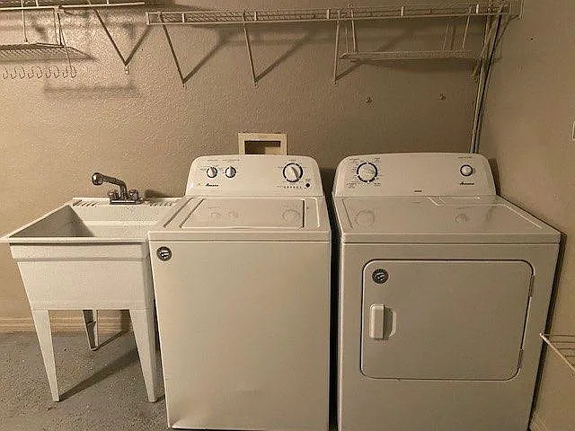 Washer and Dryer and Utility Sink included, inside garage.