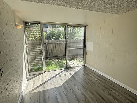 Living area and sliding door to fenced in yard