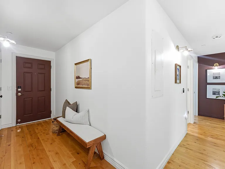 Spacious entry and hallway with storage closets