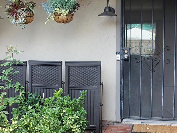Front door with brick walkway.