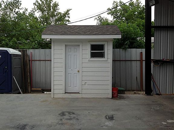 On the outside of the building their is a small bathroom.