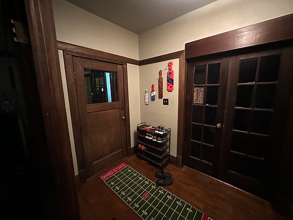 Front Hall - looking toward the front door. Beautiful, original finishes. the double doors to the right are to the 1st floor bedroom.