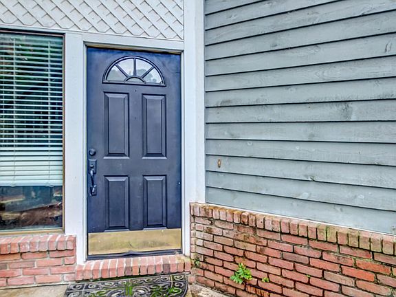 Cedar & T111 Siding w/ a Brick accent