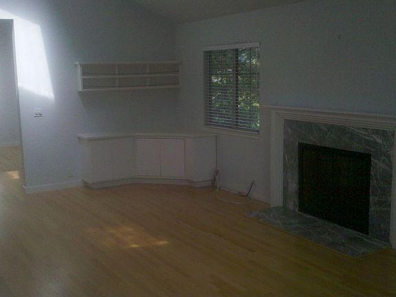 Fireplace and built-ins, hardwood floors, fireplace in family room.