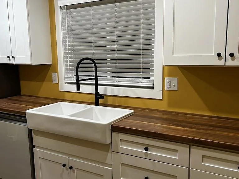 Farm sink overlooking the beautiful semi-private back yard.