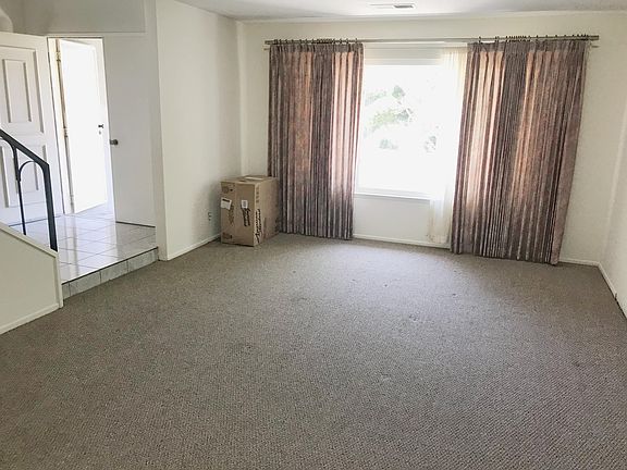 Living room area, double door front entry.