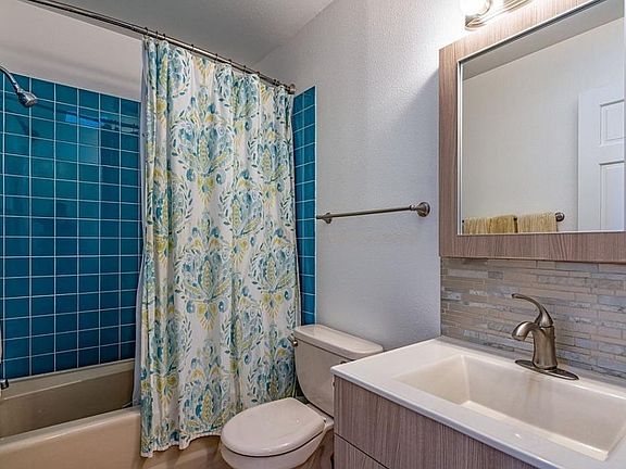 Bathroom with full tub and shower.