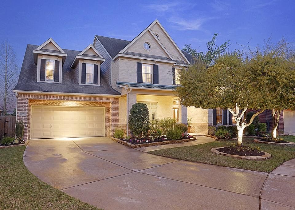 Wonderful curb appeal is the hallmark of this fine home, complete with brick and stone exterior, pro