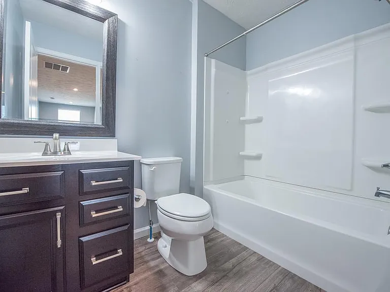 Full Bath #2. Updated with Fresh Paint, NEW Mirror, NEW Lighting, NEW Faucet, NEW Brushed Nickel Cabinet Hardware and NEW Towel Hooks.