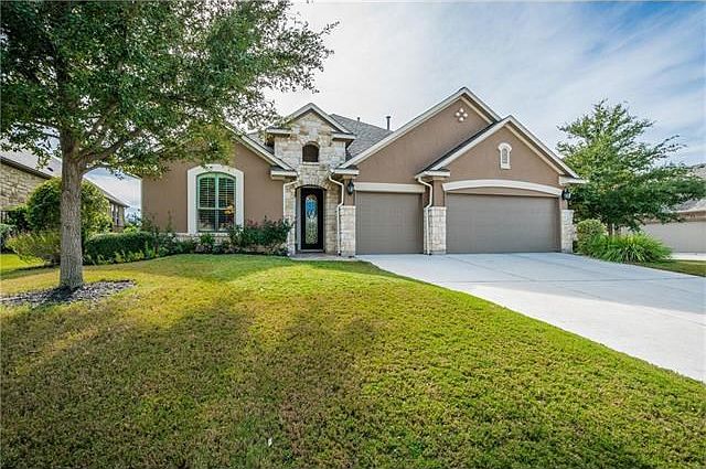 Stunning home on 70' lot. Former model with great architectural features, Austin stone, new paint an
