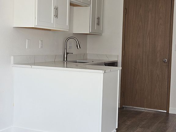Another view of the kitchen from the dining area. Washer and dryer hook ups are just on the other side of the door leading to the garage.