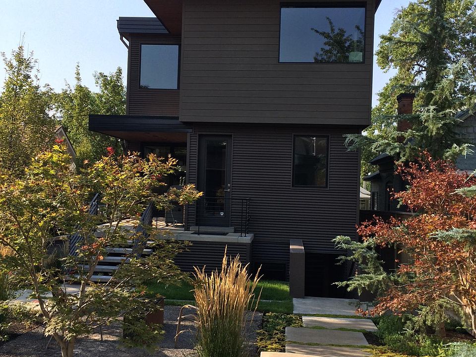 Rear of the home, entrance down the stairs on the right