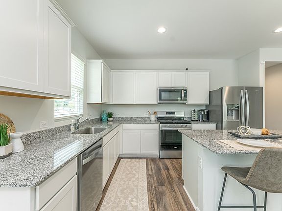 Package A Kitchen with beautiful white cabinets and granite countertops