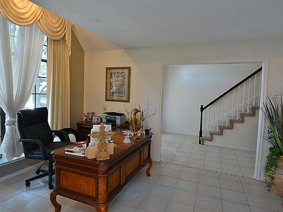 Formal living room has great space and is currently being used as an office. Open to the formal dini