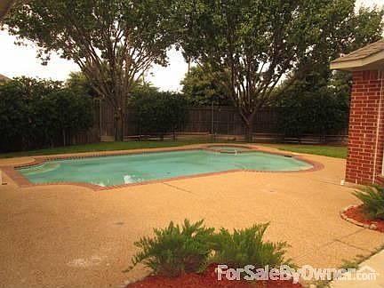 Backyard
						:
						Beautiful pool surrounded by grass and shade trees.