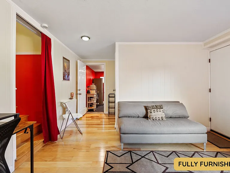Downstairs is a large bedroom with ensuite full bathroom, queen bed, smart TV, sitting area, wall table, desk & chair, dresser, XL closet, large windows and an exterior door onto the backyard. Also connects to the laundry and bonus space.