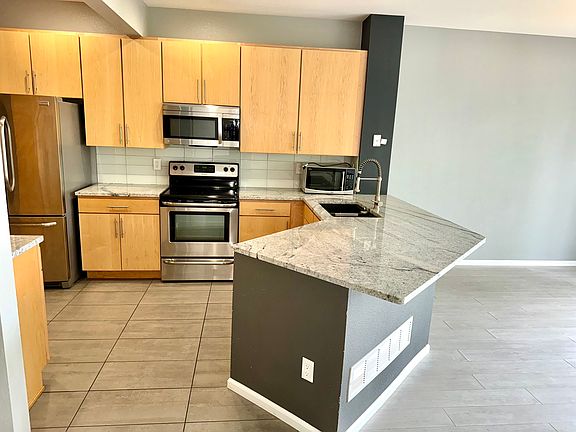 Kitchen w/ Marble Counter Tops