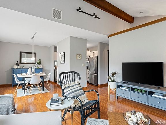 Vaulted ceilings in the living room add to the spacious experience of this home.