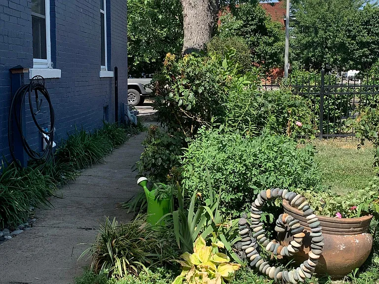 Gardens in fenced in yard.