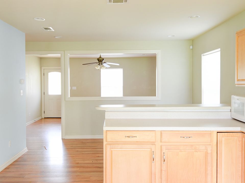 Kitchen View to Dining & Living Room