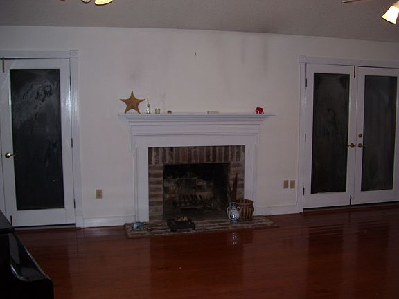 Great room with fireplace and french doors to deck